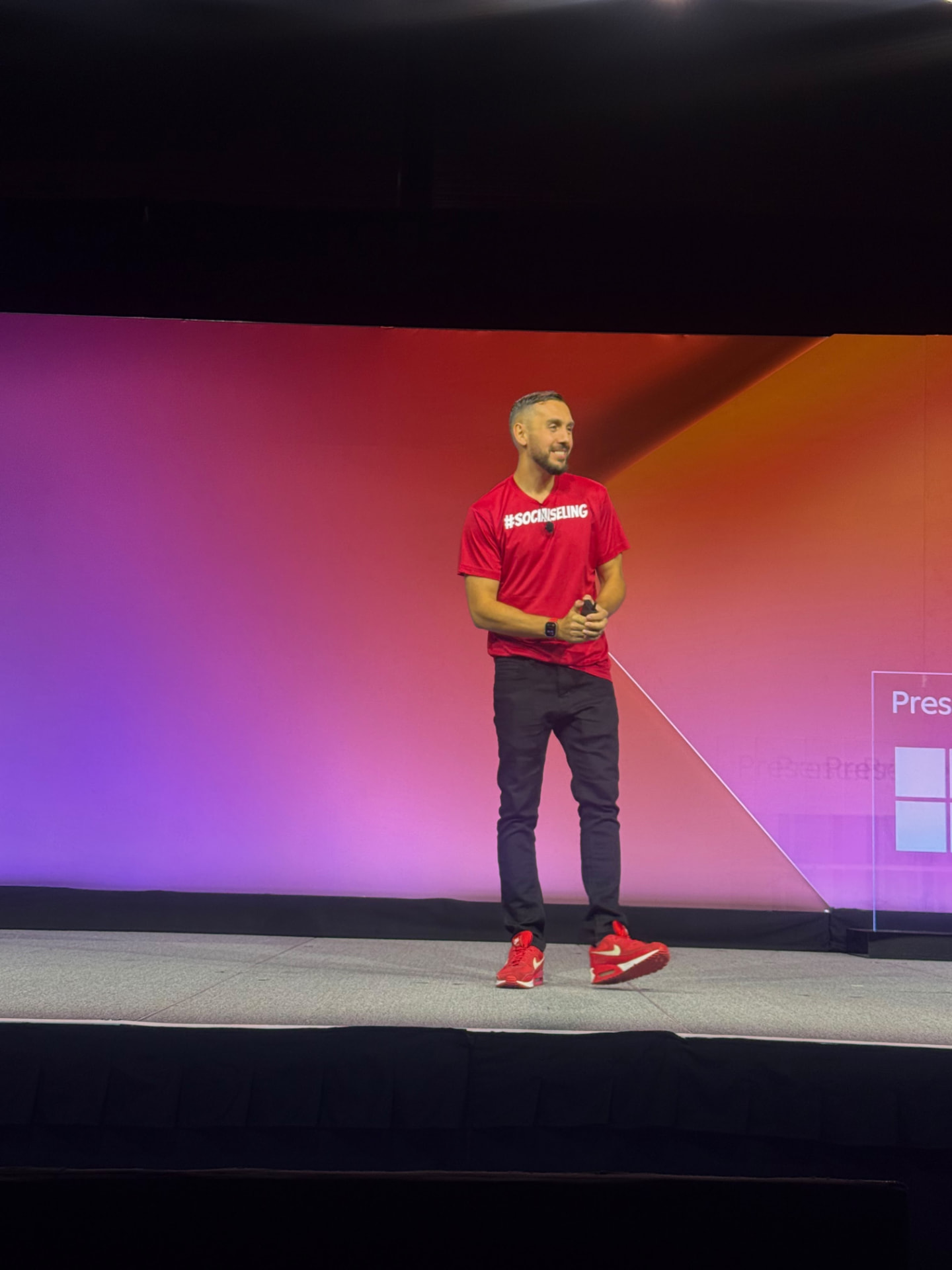 Daniel Disney speaking on stage